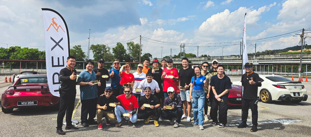 A group photo of a class participant learning how to perform donuts and handbrake turns