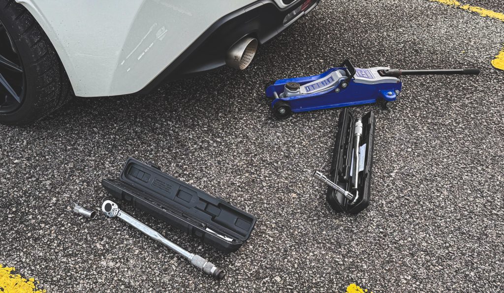 Slim car jack and a torque wrench helps with quick tyre changes during autocross events
